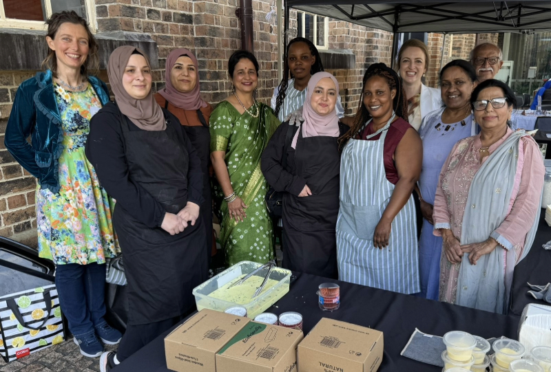 City of Newcastle's Community Development Facilitator Heidi Chappelow and Councillor Elizabeth Adamczyk join Arabic, Indian and African food makers at the Community Chef Challenge at Newcastle Museum.
